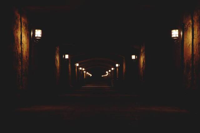 Photograph of dark, empty, lamp.