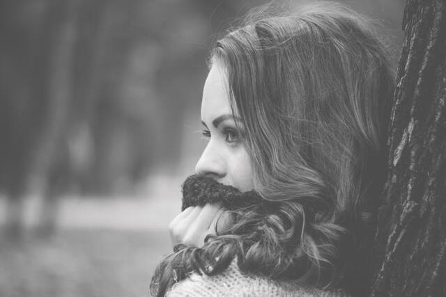 Photograph of alone, black and white, hair.