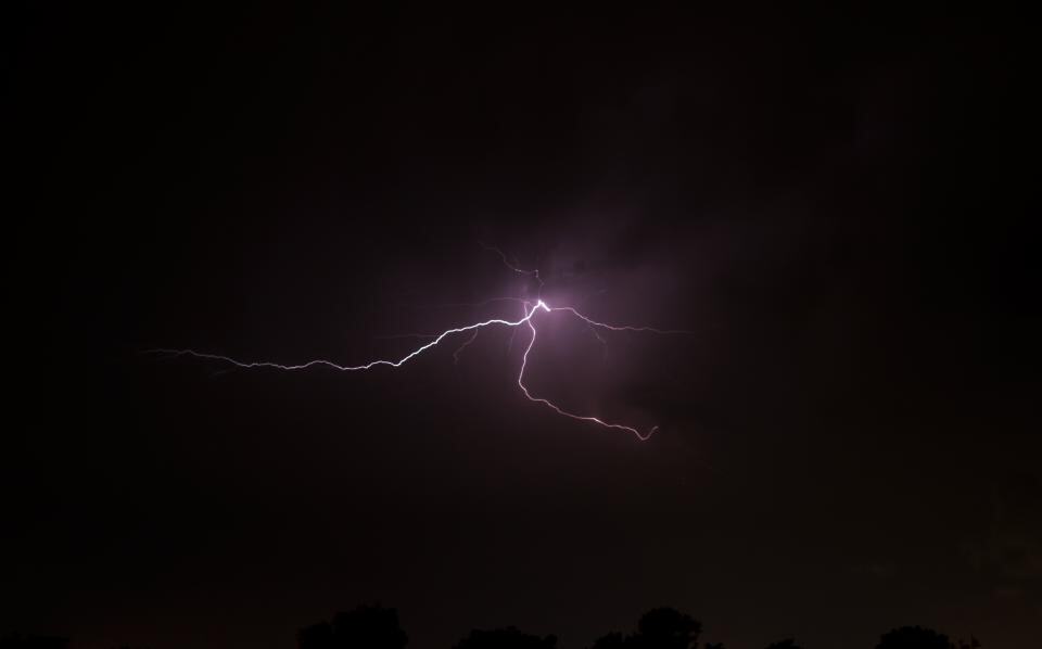 Photograph of dark, evening, lightning.