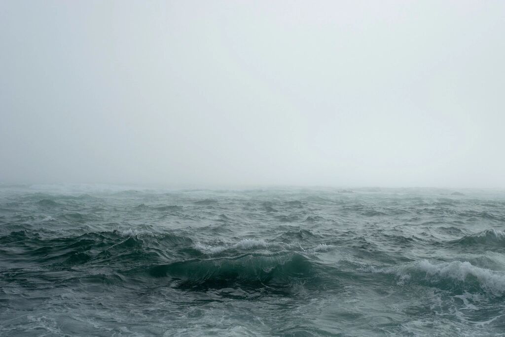 A grey sea under low cloud.